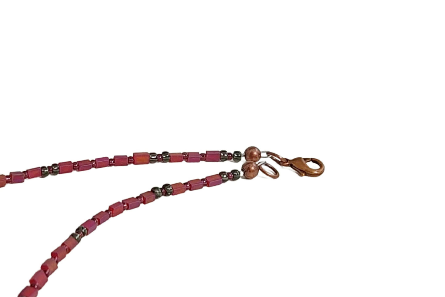 View of copper lobster clasp, which acts as the closure for the Geometric Collage Pendant Necklace.  Free Shipping in the US.