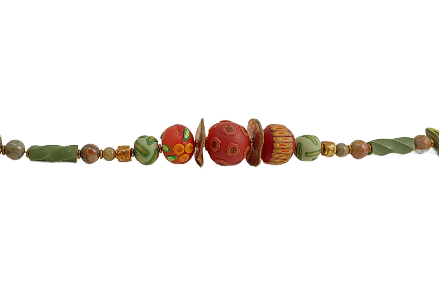 Detail of three russet hued focal beads with pod, berry, and leaf design. Lightweight. and versatile for day or evening! Free shipping in the US.