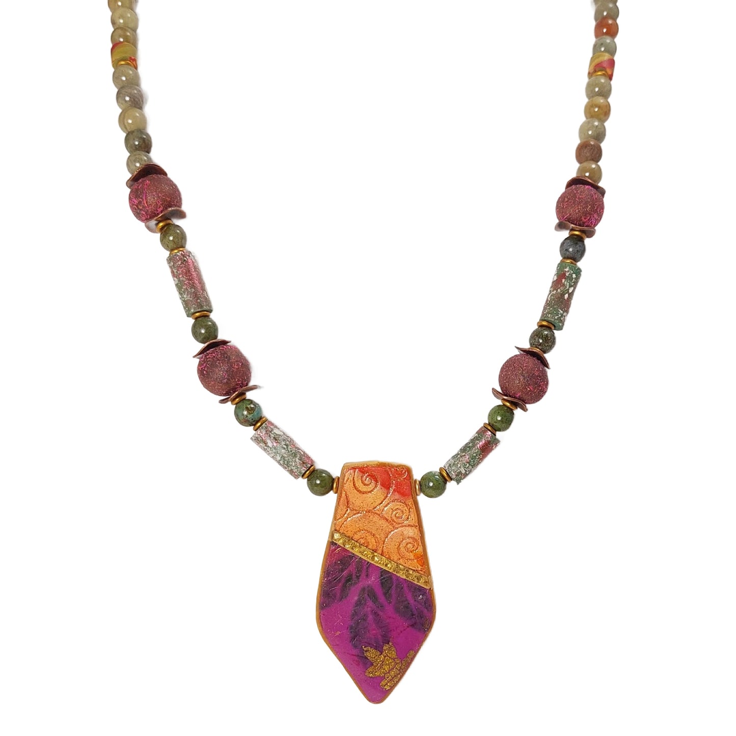 Geometric collaged polymer pendant with areas of embossed clay and image transfers of leaves, gold leaf details. Accented with silver leaf and green jasper gemstone beads, copper wavy disks, matte gold disks, iridescent polymer tube beads and textured round beads. Free shipping in the US.