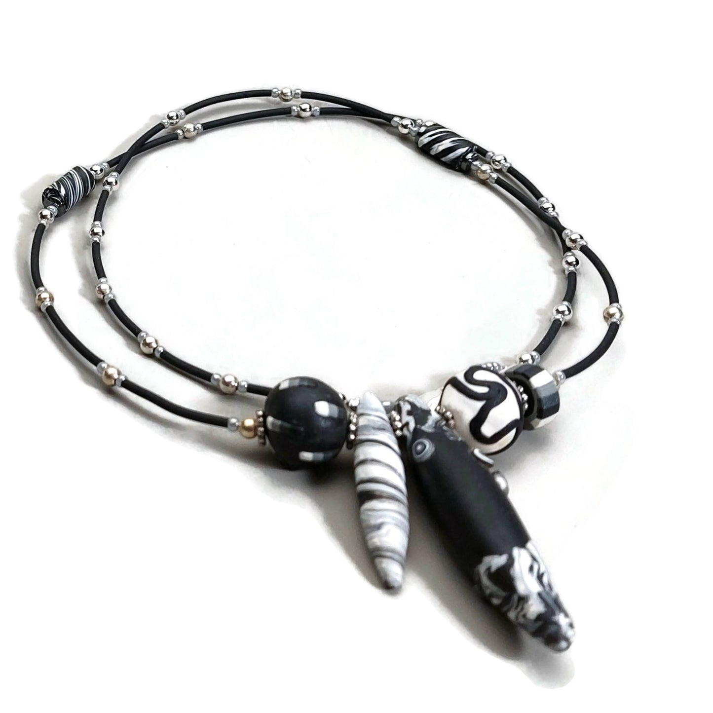 Closeup view of polymer clay necklace on white background