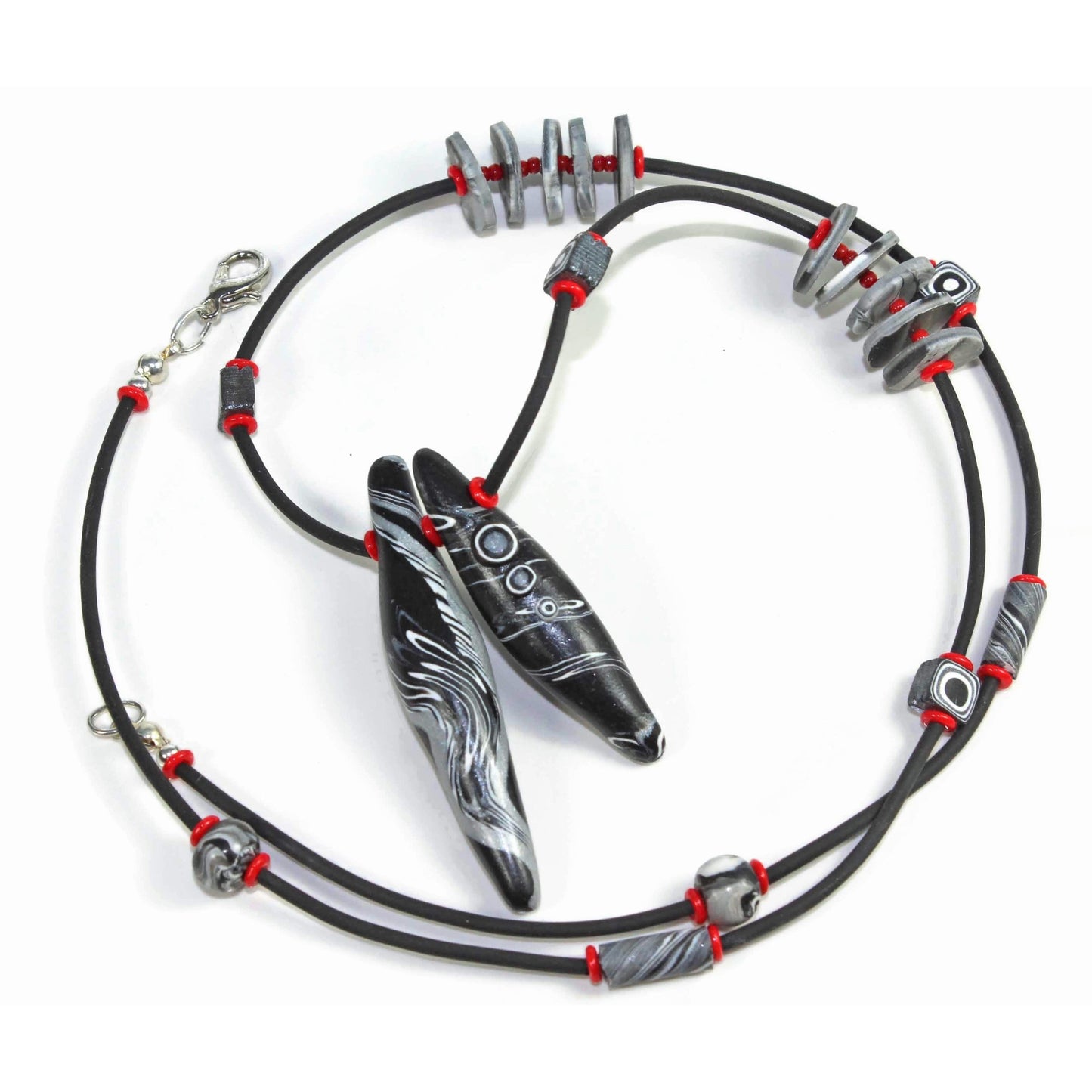 Polymer clay pod necklace with sterling silver clasp on white background