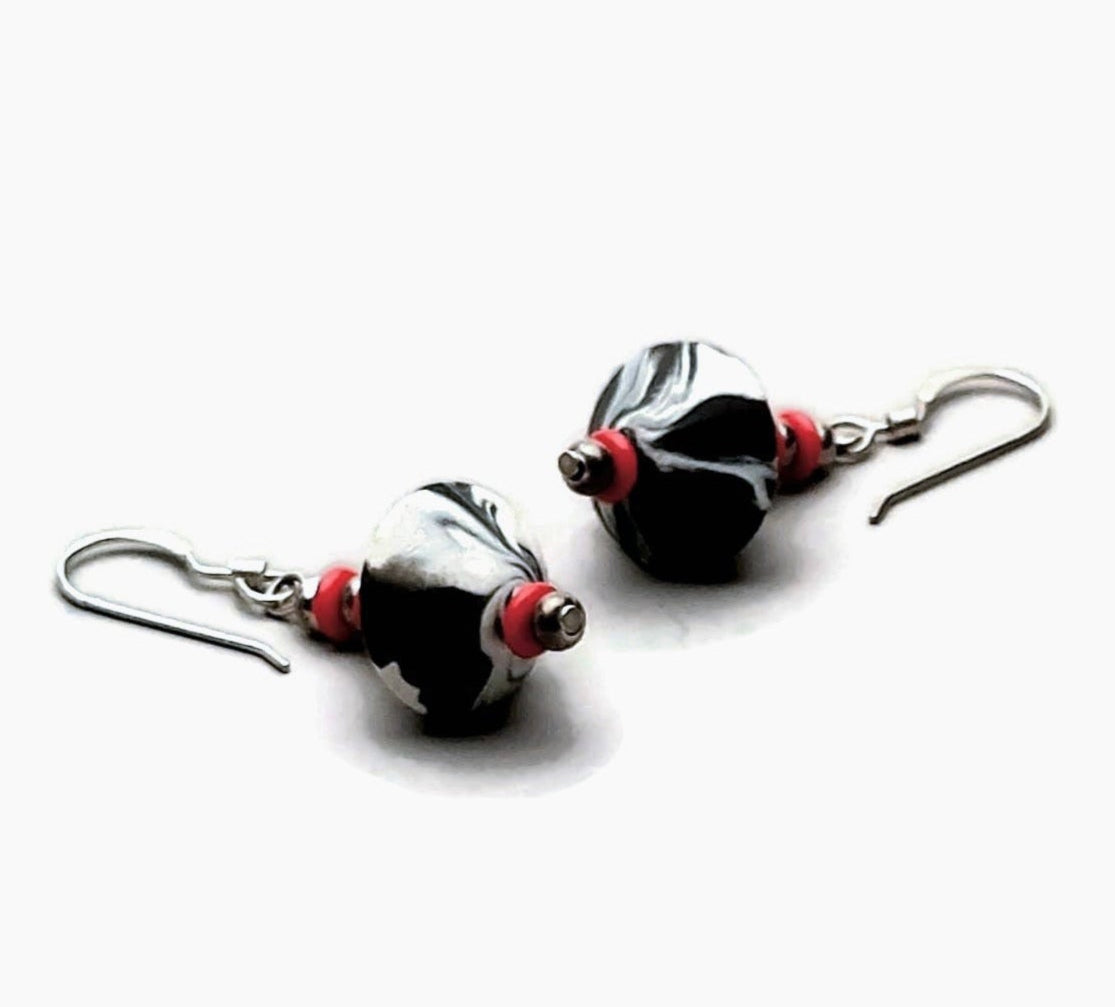 Polymer clay bicone earring with sterling silver ear wires on white background