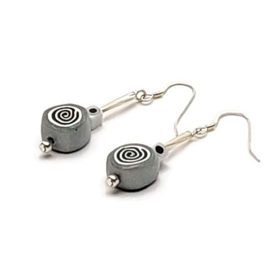 Polymer clay spiral bead drop earrings with sterling silver ear wires on white background