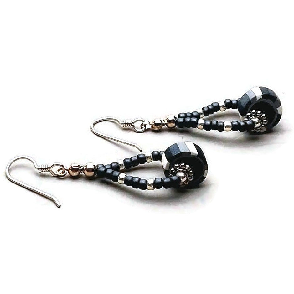 Polymer clay striped disk bead drop earrings with sterling silver ear wires on white background