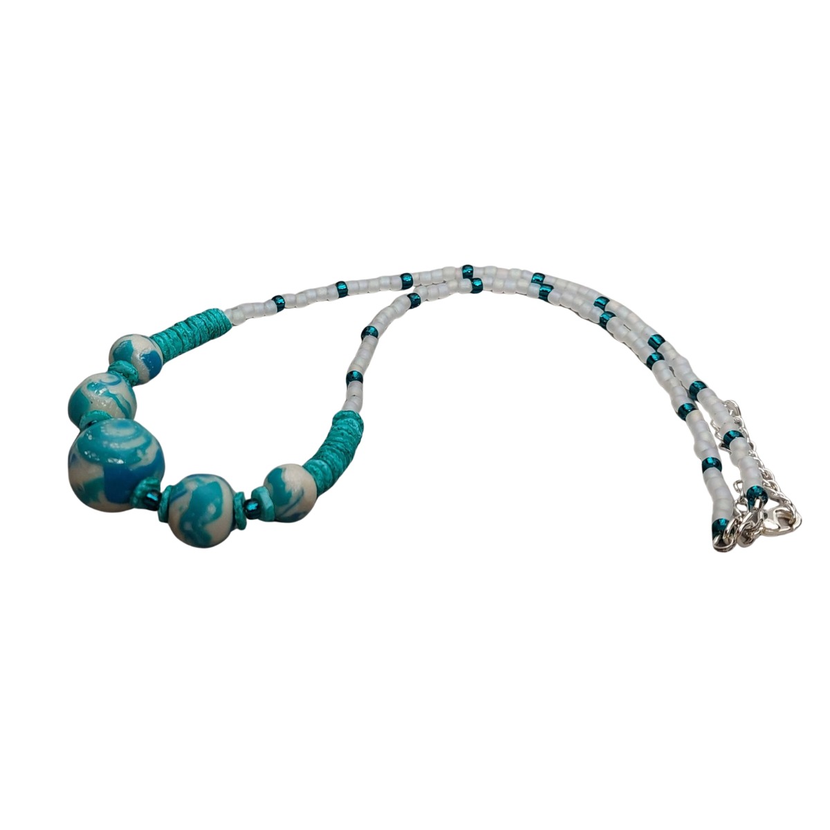 Beaded necklace with turquoise eand white beads on a white background