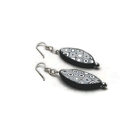 Elliptical polymer clay earrings with sterling silver ear wires on white background